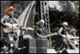 A group of people playing instruments

Description automatically generated with low confidence
