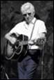 A person playing a guitar

Description automatically generated with medium confidence