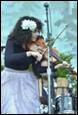 A person playing a violin

Description automatically generated
