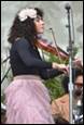 A person playing a violin

Description automatically generated