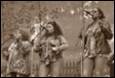 A group of women singing on stage

Description automatically generated