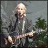 A person playing a guitar

Description automatically generated
