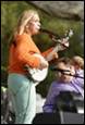 A person playing a banjo

Description automatically generated