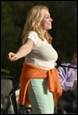 A person with her arms outstretched

Description automatically generated