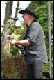 A person playing a guitar

Description automatically generated