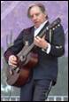 A person playing a guitar

Description automatically generated