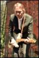 A person playing a guitar

Description automatically generated