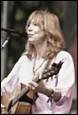 A person with a guitar

Description automatically generated