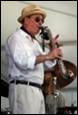 A person playing a saxophone

Description automatically generated with medium confidence