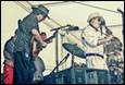 A group of people playing instruments

Description automatically generated with medium confidence