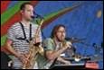 A couple of men playing instruments

Description automatically generated with low confidence