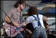A group of men playing guitars

Description automatically generated with low confidence