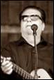 A person singing into a microphone

Description automatically generated with medium confidence