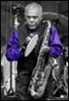 A person playing a saxophone

Description automatically generated with low confidence
