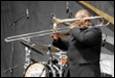 A person playing a trumpet

Description automatically generated with medium confidence