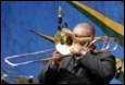 A person playing a trumpet

Description automatically generated with medium confidence