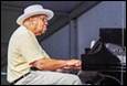 A person playing a piano

Description automatically generated with medium confidence