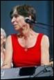 A person in a red tank top

Description automatically generated with medium confidence