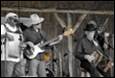 A group of men playing instruments

Description automatically generated with medium confidence