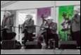 A group of people playing instruments

Description automatically generated with medium confidence