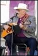 A person playing guitar and singing

Description automatically generated with low confidence
