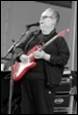 A person playing a guitar

Description automatically generated with low confidence