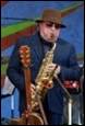 A person playing a saxophone

Description automatically generated with medium confidence