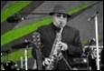 A person playing a saxophone

Description automatically generated