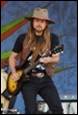 A person playing a guitar

Description automatically generated with medium confidence