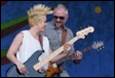 A person and person playing guitars

Description automatically generated with medium confidence