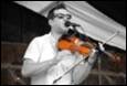A person playing a violin

Description automatically generated with low confidence