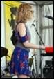 A picture containing person, clothing, concert, microphone

Description automatically generated