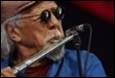A picture containing music, person, flute, music artist

Description automatically generated