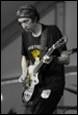 A person playing a guitar

Description automatically generated