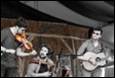 A group of people playing instruments

Description automatically generated