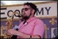 A person playing a saxophone

Description automatically generated with medium confidence
