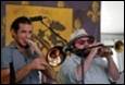 A group of men playing instruments

Description automatically generated with medium confidence