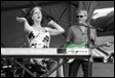 A picture containing concert, clothing, microphone, piano

Description automatically generated