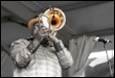 A person playing a trumpet

Description automatically generated with medium confidence