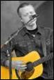 A person playing a guitar

Description automatically generated with low confidence