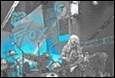 A person playing a guitar on stage

Description automatically generated with low confidence