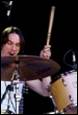 A person playing the drums

Description automatically generated with medium confidence