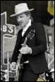 A person playing a guitar

Description automatically generated with medium confidence
