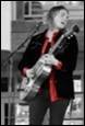 A person playing a guitar

Description automatically generated with medium confidence