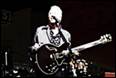 A person playing a guitar

Description automatically generated with medium confidence