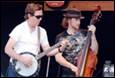A group of men playing instruments

Description automatically generated