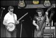 A group of men playing instruments

Description automatically generated