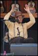 A person with his hands up

Description automatically generated