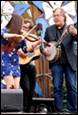 A group of people playing instruments

Description automatically generated