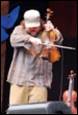 A person playing a violin

Description automatically generated